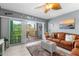 Inviting living room with balcony access, offering a seamless indoor-outdoor living experience at 8405 Placida Rd # 206, Placida, FL 33946