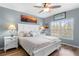 Charming bedroom with natural light, wood flooring, and a coastal inspired design at 8405 Placida Rd # 206, Placida, FL 33946