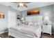 Comfortable bedroom featuring a ceiling fan and coastal-themed decor at 8405 Placida Rd # 206, Placida, FL 33946