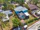 Aerial view with red property outline, highlighting the house with pool and backyard area at 938 The Rialto, Venice, FL 34285