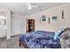 Comfortable bedroom featuring carpet, natural light, and a walk-in closet at 938 The Rialto, Venice, FL 34285