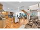 Open-concept kitchen showcasing wood cabinets, granite countertops, stainless steel appliances and an island with seating at 938 The Rialto, Venice, FL 34285