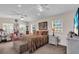 Spacious main bedroom with windows, dual ceiling fans, and a comfortable seating area at 938 The Rialto, Venice, FL 34285