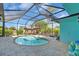 Backyard pool with screened enclosure perfect for outdoor relaxation and entertainment at 938 The Rialto, Venice, FL 34285