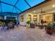 Relaxing outdoor lanai with ample seating and lush landscaping at 27336 Driver Ln, Englewood, FL 34223