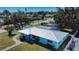 This aerial highlights this charming home's new roof, landscaping, well-maintained lawn, and neighborhood charm at 100 Aurora W St, Venice, FL 34285