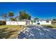 Charming, single-story home with a well-maintained lawn, driveway, and a screened-in pool area at 100 Aurora W St, Venice, FL 34285