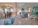 Open-concept living and dining area with tile flooring and bright, airy ambiance at 100 Aurora W St, Venice, FL 34285
