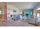 Spacious living area with tile flooring, comfortable couches, and an open layout at 100 Aurora W St, Venice, FL 34285