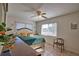 Bright main bedroom featuring neutral walls, tiled flooring, and a ceiling fan at 100 Aurora W St, Venice, FL 34285