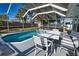 Large screened pool and backyard with ample space for entertaining in the Florida sun at 100 Aurora W St, Venice, FL 34285