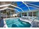 Enjoy this spacious pool with seating and an extended lanai area for relaxing or entertaining at 100 Aurora W St, Venice, FL 34285