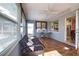 Cozy sunroom provides extra living space with tile flooring and plenty of natural light at 100 Aurora W St, Venice, FL 34285