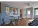 Inviting sunroom featuring neutral paint, windows and furniture for relaxing and entertaining at 100 Aurora W St, Venice, FL 34285