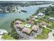 Aerial view of waterfront condos with a communal pool and private boat docks, near bay homes at 101 Louella Ln # 11, Nokomis, FL 34275