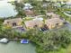 Aerial view of waterfront condos with docks, surrounded by lush greenery at 101 Louella Ln # 11, Nokomis, FL 34275