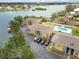 Aerial view showcasing the community's waterfront location and swimming pool at 101 Louella Ln # 11, Nokomis, FL 34275