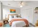 Bedroom with a ceiling fan, neutral tones, and a large window offering plenty of natural light at 101 Louella Ln # 11, Nokomis, FL 34275