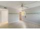 Bedroom featuring wood-look floors and a walk-in closet at 101 Louella Ln # 11, Nokomis, FL 34275