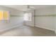 Bright and airy bedroom with neutral walls, decorative border, and lots of natural light at 101 Louella Ln # 11, Nokomis, FL 34275