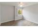 Bedroom with hardwood flooring, a window, and neutral colored walls at 101 Louella Ln # 11, Nokomis, FL 34275