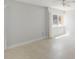 Bright bedroom with tile flooring, ample natural light, and neutral paint color at 101 Louella Ln # 11, Nokomis, FL 34275
