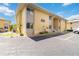Exterior view of the building with a well maintained parking lot and landscaping at 101 Louella Ln # 11, Nokomis, FL 34275