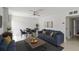 Modern living room featuring stylish furniture, a ceiling fan, and neutral wall color at 101 Louella Ln # 11, Nokomis, FL 34275