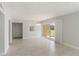 Bright living room with tile flooring, closet doors and sliding glass doors to the outside at 101 Louella Ln # 11, Nokomis, FL 34275