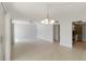 Open concept living room boasts tile flooring, a ceiling fan, and natural light at 101 Louella Ln # 11, Nokomis, FL 34275