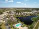 Scenic aerial view showcases the community's desirable location, ponds, and lush surroundings at 11026 Barnsley Dr, Venice, FL 34293