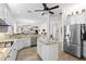 Spacious kitchen with white cabinetry, granite countertops, and stainless steel appliances at 11026 Barnsley Dr, Venice, FL 34293