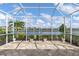 Screened-in patio featuring beautiful water views at 11026 Barnsley Dr, Venice, FL 34293