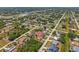 Community aerial view pinpointing a home with a pool, surrounded by lush landscaping and well-spaced single-Gathering homes at 11153 Deerwood Ave, Englewood, FL 34224