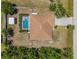 Aerial view of property featuring a fenced yard, screened pool and driveway at 11153 Deerwood Ave, Englewood, FL 34224