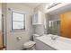 Well-lit bathroom with a modern vanity, mirror, cabinet, and a glass-enclosed shower at 11153 Deerwood Ave, Englewood, FL 34224