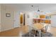 Light dining room with a view of the kitchen and living room at 11153 Deerwood Ave, Englewood, FL 34224