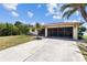 Well-maintained home with a large driveway and a screened-in garage, ideal for added living space at 11153 Deerwood Ave, Englewood, FL 34224