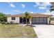 Charming single-story home with a well-maintained lawn and inviting curb appeal at 11153 Deerwood Ave, Englewood, FL 34224