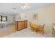 Open floor plan showing kitchen and dining area with light-colored walls and flooring at 11153 Deerwood Ave, Englewood, FL 34224