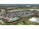 An aerial view shows the pool, clubhouse, golf course, tennis courts and parking at the community at 115 Babbling Brook Run, Bradenton, FL 34212