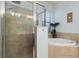 Neutral bathroom with a glass shower, soaking tub, tile accents, and a window for natural light at 115 Babbling Brook Run, Bradenton, FL 34212