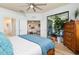 Bedroom showcasing a spacious layout with a doorway view of the living room and sliding glass doors to the outside at 115 Babbling Brook Run, Bradenton, FL 34212