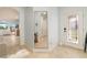 Bright foyer featuring tile floors, a decorative mirror, and a glass-paneled front door that brings in natural light at 115 Babbling Brook Run, Bradenton, FL 34212