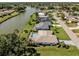 Waterfront property featuring a private pool and landscaping, and expansive views at 1232 Pine Needle Rd, Venice, FL 34285