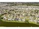 Community aerial view of single Gathering homes with lake access and pools at 1232 Pine Needle Rd, Venice, FL 34285