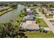 Waterfront property featuring a private pool and landscaping, and expansive views at 1232 Pine Needle Rd, Venice, FL 34285
