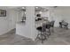 View of the kitchen breakfast bar with seating at 1232 Pine Needle Rd, Venice, FL 34285