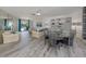 Open-concept living area offers pool views, plenty of space for relaxation, and natural light at 1232 Pine Needle Rd, Venice, FL 34285