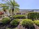 A private backyard oasis with lush landscaping and screened-in lanai at 13166 Huerta St, Venice, FL 34293